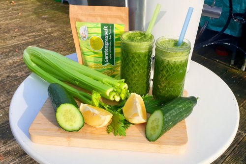 Fresh green celery juice with barley grass juice powder