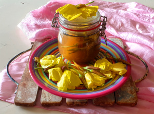 Evening primrose buds and flowers in a jar